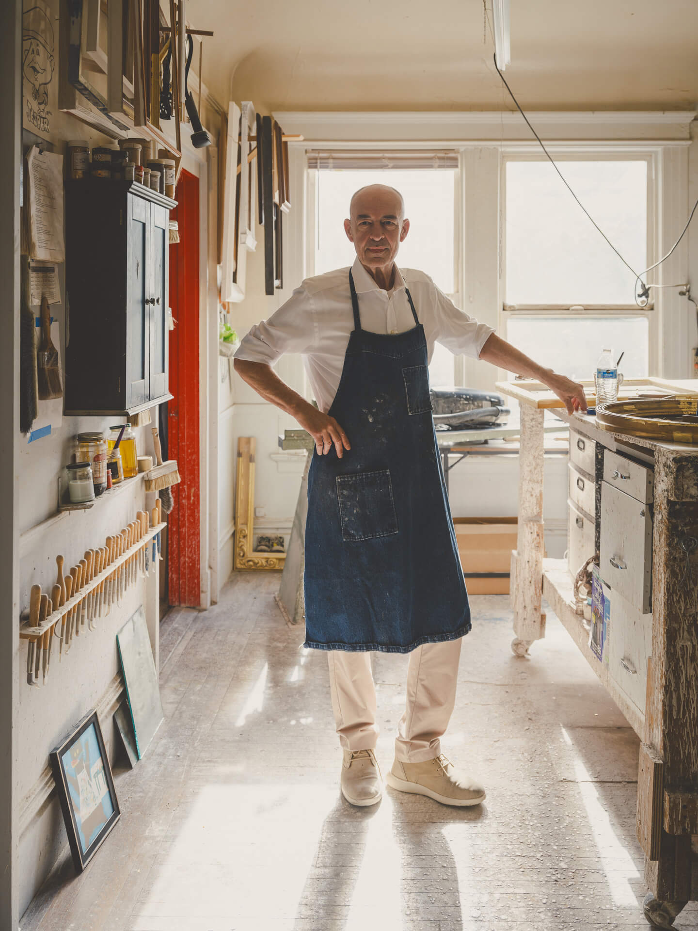 Artisan Peter Werkhoven standing in the Aedicule framing and gilding workshop in San Francisco.